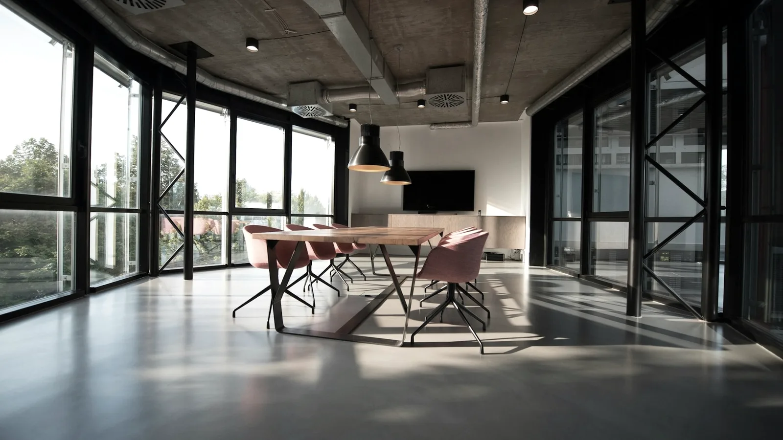A quiet meeting room with a long table